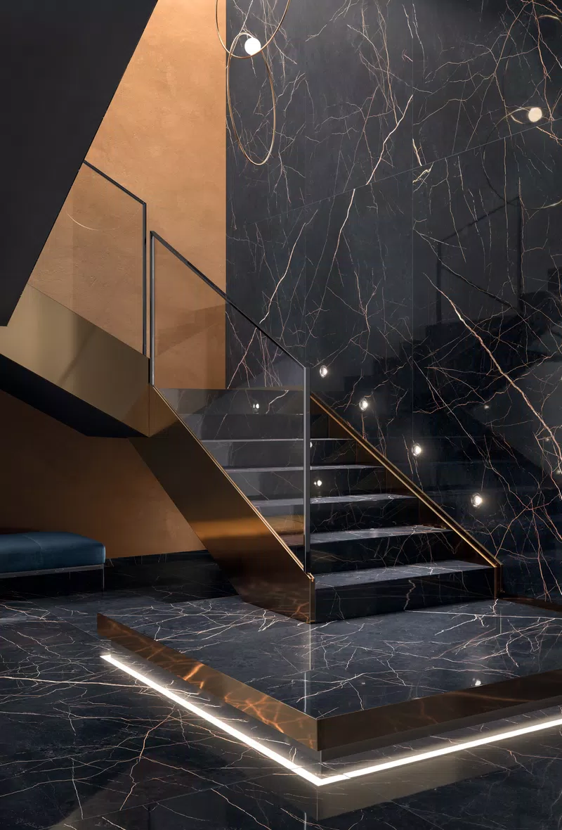 Supreme Evo collection by Flaviker: marble-effect tiles in white, black, grey tones.
